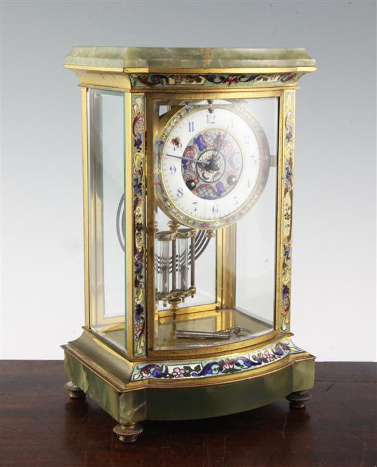 An early 20th century French champlevé enamelled ormolu and green onyx four glass mantel clock, 12in.